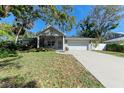 Charming single Gathering home with lush landscaping and a two-car garage, in a desirable neighborhood at 51 Webb St, Osprey, FL 34229
