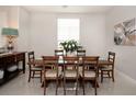 Dining room with large table and chairs, and ample natural light at 7095 Tamworth Pkwy, Sarasota, FL 34241