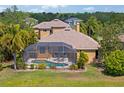 Outdoor living featuring a screened-in pool and covered lanai, perfect for entertaining and relaxation at 12420 Aster Ave, Bradenton, FL 34212