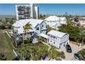 Stunning exterior shot of two story home showcasing architecture, curb appeal and balcony at 137 Big Pass Ln, Sarasota, FL 34242