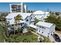 Stunning exterior shot of two story home showcasing architecture, curb appeal and balcony at 137 Big Pass Ln, Sarasota, FL 34242