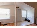 Inviting entryway with neutral tones, tiled floors and bright windows at 1704 Ballard Park Dr, Bradenton, FL 34205