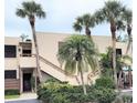 Charming condo complex exterior, nestled among verdant landscaping with scenic, serene appeal and convenient entrances at 182 Pineneedle Dr # 182, Bradenton, FL 34210