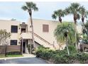 Condo building with stairs to the second level with lush, tropical landscaping and a relaxing Florida lifestyle at 182 Pineneedle Dr # 182, Bradenton, FL 34210