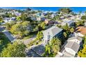 Beautiful two-story house with a manicured lawn near beach and a brick paver driveway at 2300 Avenue B, Bradenton Beach, FL 34217