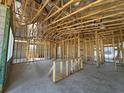 Framed interior view highlighting the open floor plan of the new construction home at 278 Hillshire Pl, Spring Hill, FL 34609