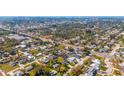 Expansive aerial view of a residential neighborhood with tree-lined streets near a river at 2830 Gypsy St, Sarasota, FL 34231