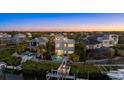 Aerial view of waterfront home with a pool, dock, and lush tropical landscaping at 4607 5Th Ne Ave, Bradenton, FL 34208