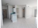 Spacious living room with white tile flooring, and neutral walls ready for personal touches at 5168 Northridge Rd # 209, Sarasota, FL 34238