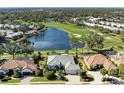 Sweeping aerial view showcasing the home's prime location near a lake, golf course, and community at 5224 88Th E St, Bradenton, FL 34211