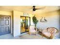Inviting patio with sliding glass doors, offering comfortable seating and tranquil outdoor living at 5685 Palmer Cir # 202, Bradenton, FL 34211
