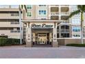 Elegant entrance to River Dance with covered entry and well-maintained landscaping at 808 3Rd W Ave # 205, Bradenton, FL 34205