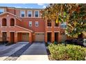 Beautiful two-story townhome featuring a two-car garage and a well-manicured front yard at 8662 Majestic Elm Ct, Lakewood Ranch, FL 34202