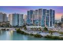 Modern high-rise condominiums boast sleek architecture and stunning waterfront views at 1155 N Gulfstream Ave # 1205, Sarasota, FL 34236