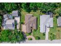 Aerial view of the home showcasing the roof, landscaping, and neighborhood at 2114 147Th E Ct, Bradenton, FL 34212