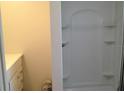 Clean bathroom with a built-in shower niche and a sleek, modern design at 22337 Olean Blvd, Port Charlotte, FL 33952
