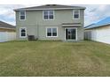 Spacious backyard with lush green grass, offering plenty of room for activities at 2409 Sand Gables Trl, Bradenton, FL 34208