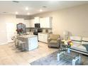 Open concept design showing the living room and kitchen, featuring modern decor and natural light at 2846 Midnight Pearl Dr, Sarasota, FL 34240