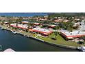 Attractive aerial shot of the property, highlighting its waterfront location and proximity to community amenities at 4216 El Dorado Cv, Bradenton, FL 34210