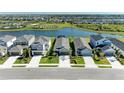 Scenic neighborhood with a lake, showcasing manicured lawns and well-spaced homes at 4253 Pond Brook Ct, Bradenton, FL 34211