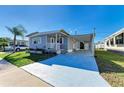 Charming single-story home featuring a cozy front porch and a covered carport for convenience at 5619 Bayshore Rd # 107, Palmetto, FL 34221