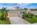 Charming single-story home featuring a well-manicured lawn and inviting curb appeal at 16966 Rosedown Gln, Parrish, FL 34219
