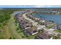Lakefront community featuring stunning homes, lush landscaping, with beautiful water views at 17045 Polo Trl, Bradenton, FL 34211