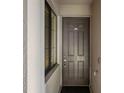 Condo front door featuring a lock, doorbell, and unit number at 17902 Gawthrop Dr # 302, Lakewood Ranch, FL 34211