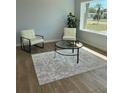 Bright living room featuring hardwood floors, neutral walls, and modern furniture near a sunlit window at 2404 Lehigh Ave, Bradenton, FL 34207