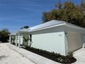 Well maintained home featuring a metal roof, manicured landscaping, and a one-car garage at 3525 Mcintosh Rd, Sarasota, FL 34232