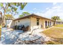 Beautiful backyard patio with outdoor seating and well manicured landscaping, perfect for relaxation at 411 S Oxford Dr # 411, Nokomis, FL 34275