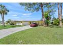 Charming single-story home with a well-manicured lawn and a long driveway, perfect for suburban living at 4320 Bent Tree Blvd, Sarasota, FL 34241