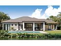 The home's rear exterior has an inviting pool, lots of outdoor space, and water views at 4644 Higel Ave, Sarasota, FL 34242