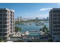 Elegant pool area with city and marina views, perfect for relaxation and entertainment at 550 Golden Gate Point # 304, Sarasota, FL 34236
