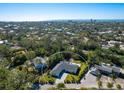 Aerial view of a beautiful house showing the pool and landscape at 749 Tropical Cir, Sarasota, FL 34242