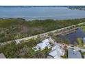 Stunning waterfront property with a private pool, lush landscaping, and serene bay views at 8227 37Th Avenue W Cir, Bradenton, FL 34209