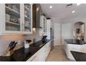 Modern kitchen with white cabinetry, stainless steel appliances, and a spacious island at 8227 37Th Avenue W Cir, Bradenton, FL 34209