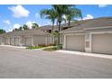 Attached garages for resident parking, located in a serene and inviting neighborhood setting at 9580 High Gate Dr # 1822, Sarasota, FL 34238