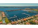 Stunning aerial view of the harborside community, showcasing the marina, waterfront homes, and the gorgeous ocean beyond at 1009 3Rd E St, Palmetto, FL 34221