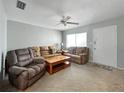 Inviting living room with neutral tones, ceiling fan, and comfortable seating arrangement at 11251 80Th Ave # 305, Seminole, FL 33772