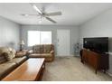 Cozy living room featuring a ceiling fan and comfortable seating, perfect for relaxation at 11251 80Th Ave # 305, Seminole, FL 33772