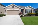Charming single-Gathering home featuring a two-car garage and well-manicured lawn at 12533 Night View Dr, Sarasota, FL 34238