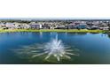 Scenic water view of a pristine lake featuring a tranquil fountain at 12533 Night View Dr, Sarasota, FL 34238
