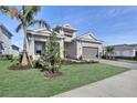 A charming single-Gathering home boasts lush landscaping, a paver driveway, and a convenient two-car garage at 17907 Palmiste Dr, Bradenton, FL 34202