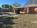 View of the home's backyard, featuring a small shed and lush lawn at 1804 Bayshore Gardens Pkwy, Bradenton, FL 34207