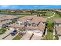 Overhead view of villa complex with access to a golf course and community pond at 18113 Gawthrop Dr # 103, Bradenton, FL 34211