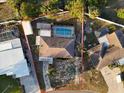 Aerial view of property showing the layout of the home, large pool, fenced yard, and surrounding neighborhood at 2207 Holyoke Ave, Bradenton, FL 34207