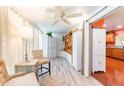 Inviting sun room with abundant natural light and a view into the kitchen at 2409 Gun Flint Trl, Palm Harbor, FL 34683