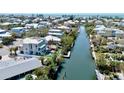 Waterfront residence with a tiki hut, dock, pool, and easy access to the Gulf of Mexico at 244 Willow Ave, Anna Maria, FL 34216