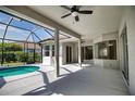 Covered patio with screened-in pool area providing an outdoor entertaining space and an inground pool at 271 Petrel Trl, Bradenton, FL 34212